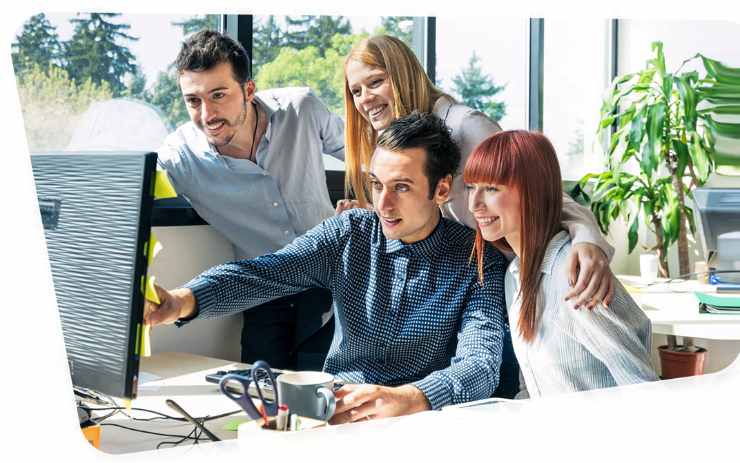 two man and two woman looking at the computer monitor